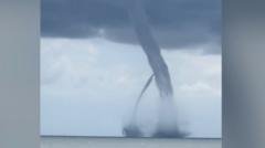 Watch: Twin waterspouts merge near Italian coastline​​