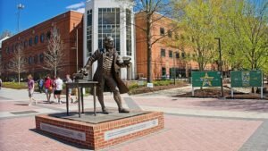 GMU board agrees to cut DEI programs while unanimously approving raise for embattled president​​